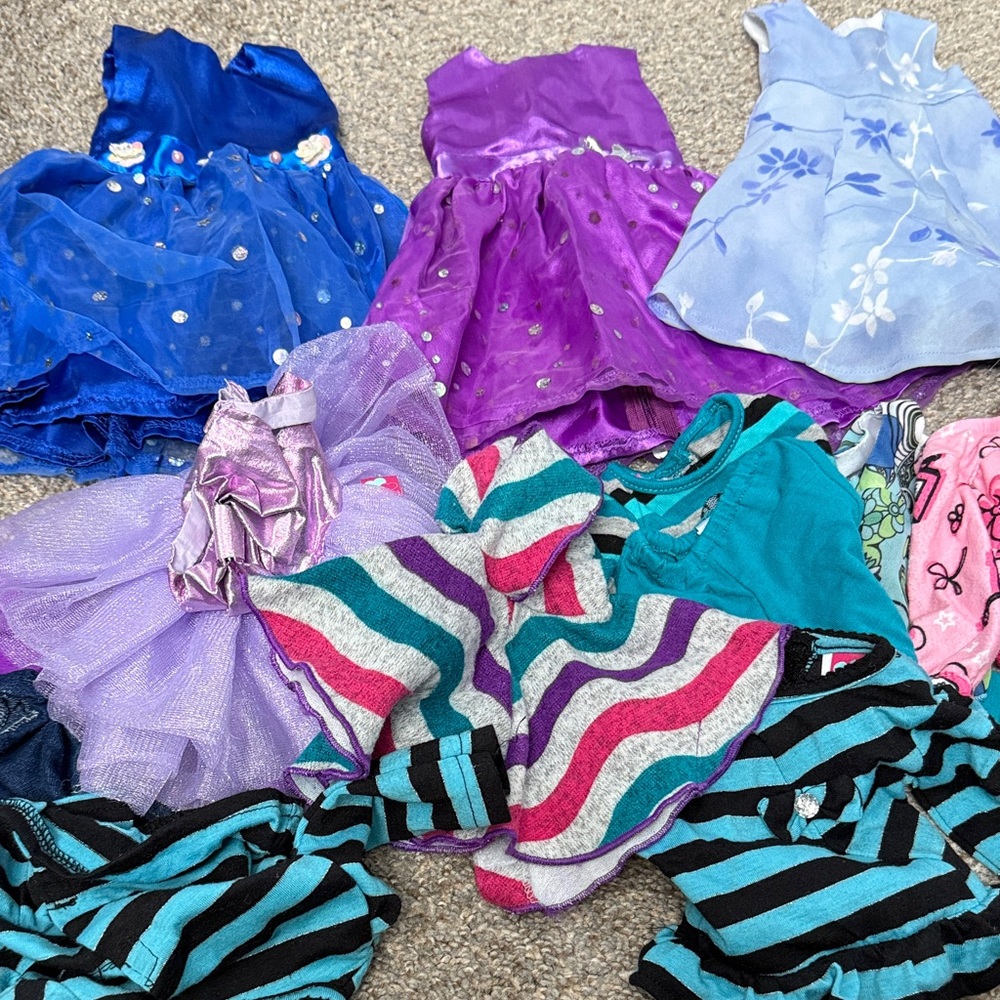 A Lot of Doll clothes. That will fit an American Girl type doll.